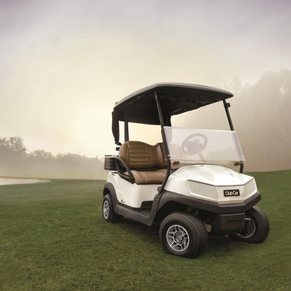 White Club Car Tempo golf cart on a grassy field with a misty background